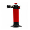 A handheld  Blazer Hot Shot MT-3000 Butane Refillable Micro Torch with a ribbed red body, black top and base, and red adjustment knobs, shown on a plain white background.