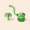 Green glass smoking device on a beige background