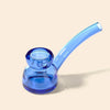 A translucent light blue glass water pipe by NWTN Home with a curved stem and a wide base, shown on a solid light beige background.