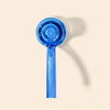 A translucent blue hand pipe with a long handle, shown from a top-down perspective on a light beige background with a soft shadow.